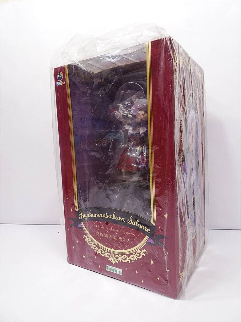 01 1 | Vtuberグッズ買取専門店 Boxed anime figure in clear plastic wrap, burgundy-gold packaging with ornate design and 'Salome' label visible through the window