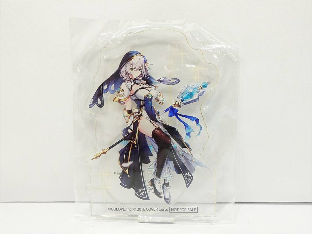 Anime-style female warrior in blue and white armor, sealed in clear plastic packaging.