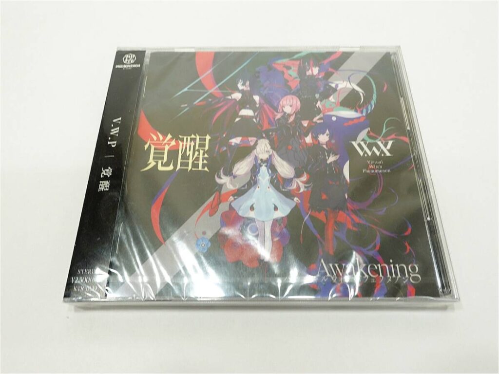 CD case on a white background showing an anime-style cover with colorful characters and the title 'Awakening'.