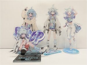 Set of clear acrylic standees featuring a blue-haired anime girl in different outfits, arranged on display bases.