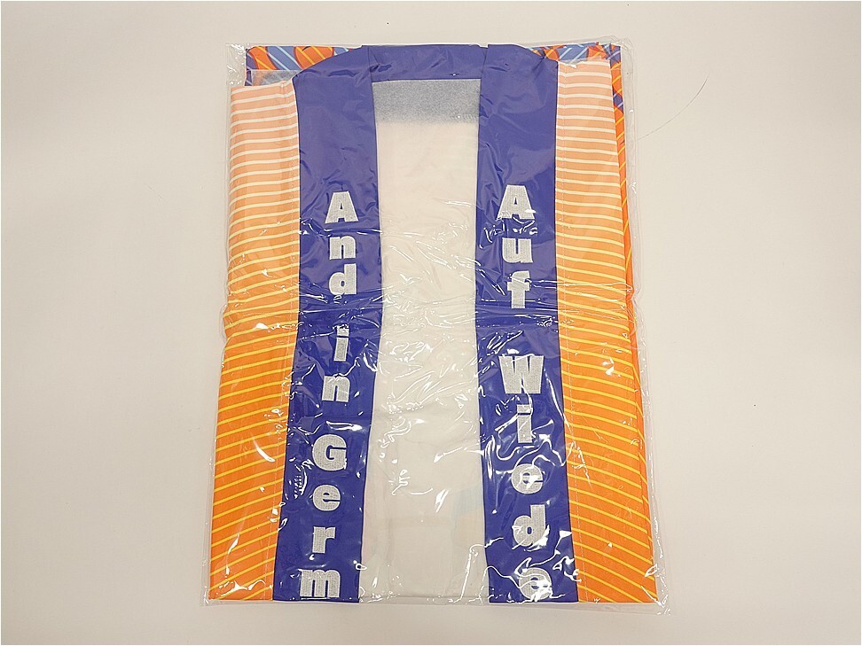 Inflatable life jacket with orange striped sides and blue center panels, packaged in plastic; labels read 'Adult' and 'Infant' on the straps.
