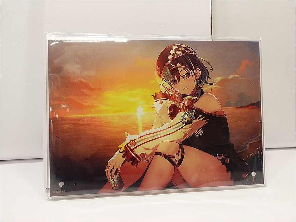 Anime-style girl sitting on the shore at sunset, wearing a black outfit and a checkered cap, gazing toward the viewer.