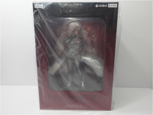 image | Vtuberグッズ買取専門店 Box containing a 1/7 scale figure named Lauren Iroas, visible through the window on pink packaging.