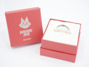 image | Vtuberグッズ買取専門店 Open pink jewelry box reveals a silver ring with a patterned band and red gem on white foam insert.