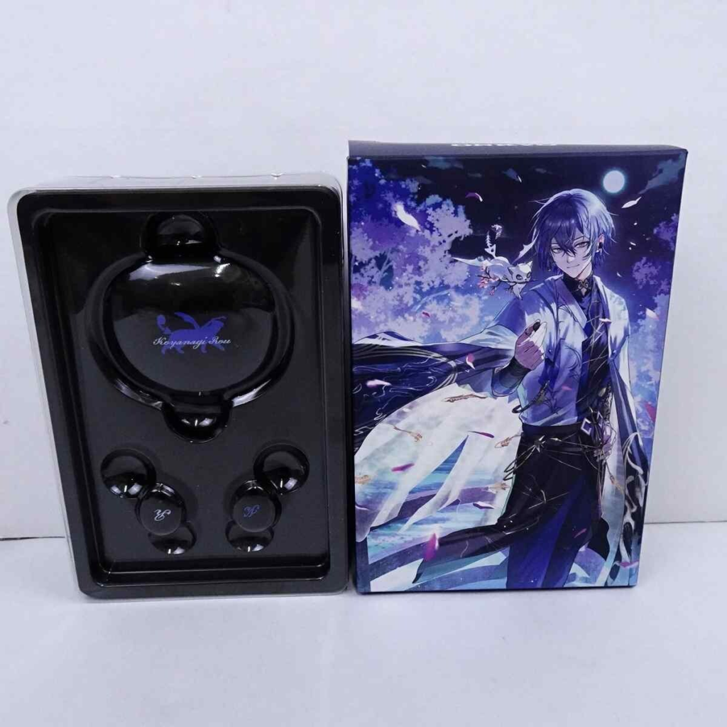 image - Vtuberグッズ買取専門店Vtrader Black wireless earbud set in plastic tray beside a purple-night anime box with a blue-haired character in white-and-black clothing.