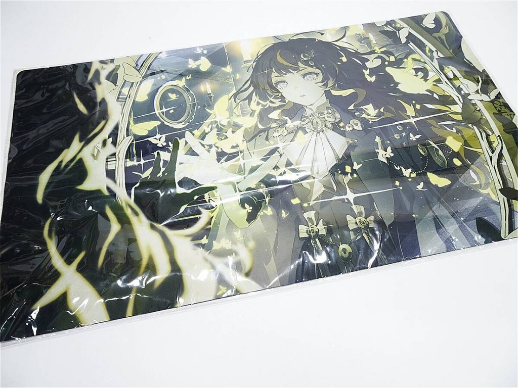 j12069565921 1 | Vtuberグッズ買取専門店 Anime-style illustration of a girl in an ornate dress with yellow butterfly motifs, wrapped in plastic.