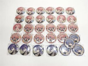 Grid of collectible round pin badges in plastic packaging, arranged in a neat grid across a white background, featuring pink- and purple-haired anime characters.