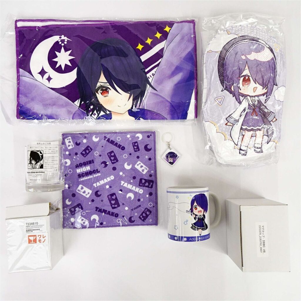 r12149746471 | Vtuberグッズ買取専門店 Collection of purple anime merchandise featuring a chibi character: tote bag, pillow, notebook, mug, keychain, and packaging.