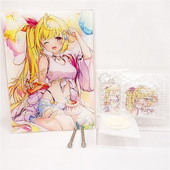 w12134773691 | Vtuberグッズ買取専門店 Anime art print of a blonde girl in a bikini, winking with cake in front, shown with protective packaging and bubble wrap nearby.